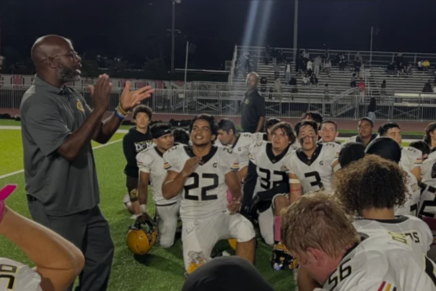 Coach Franklin speaks to his team during the Oct. 19 game against Gahr High School. Photo taken by Cristian Vasquez.