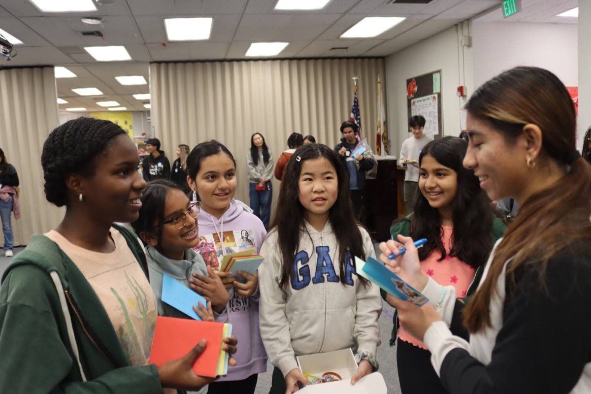 Leadership member Jassie Tejada speaks with Cerritos Elementary students