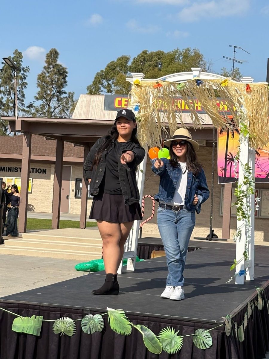 Freshmen Aizel Cruz and Chloe Nauli pose on stage.