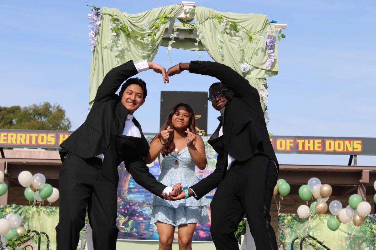 Juniors Kevis Deshar (left), Juliana Teh (middle), and Janold Blanshard (right) strike a pose on stage. Photo taken by Krish Kohli, used with permission.