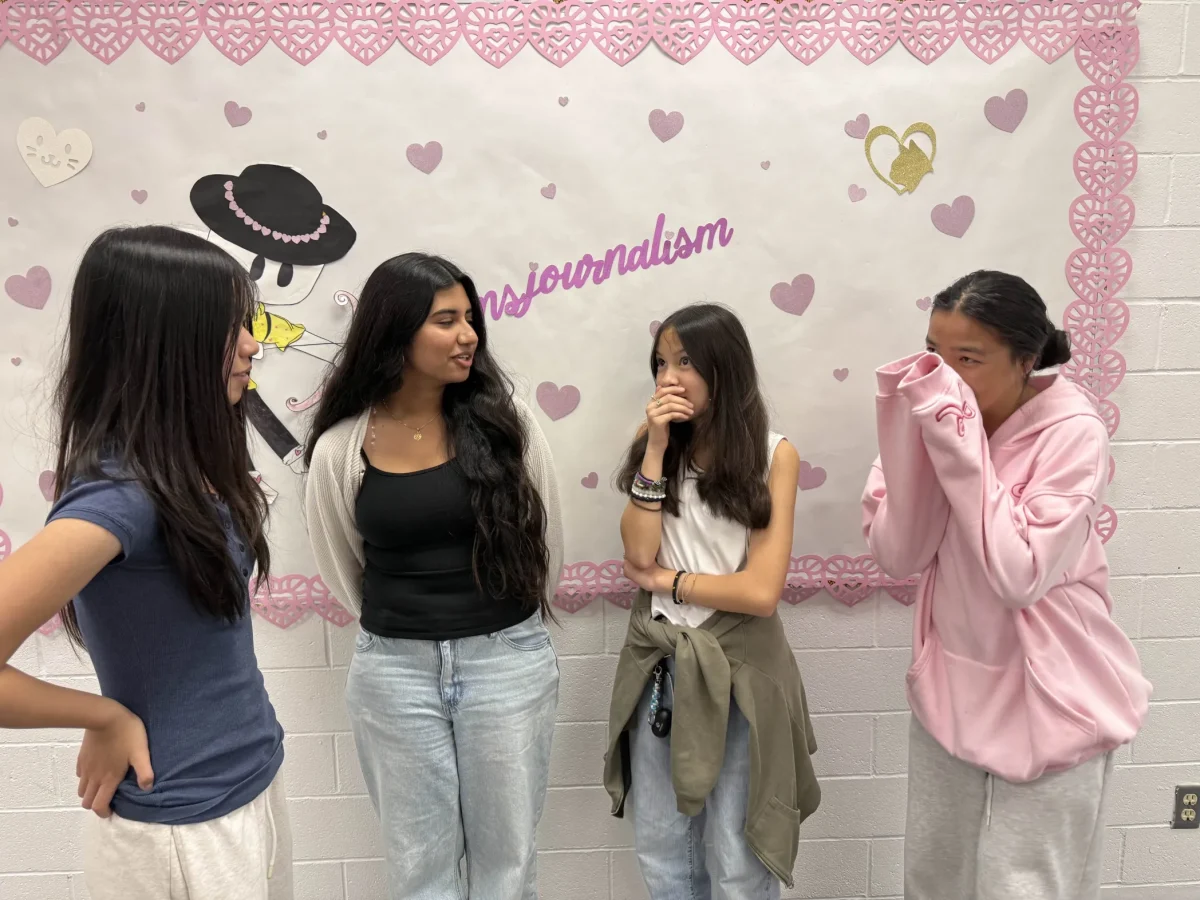 Freshmen Allyson Bunla, Pryanka Singh, Olivia Nguyen discuss their Galentine's Day plans together. Photo taken by Salvador Flores.