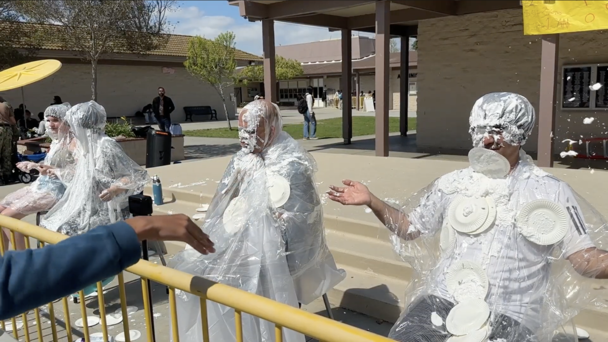 From left to right: ASB representatives Morgan Stecher and Amy Ge, as well as teachers Mr. Terryll Wooldridge and Mr. Johnathan Watanabe get plates of whipped cream thrown at their face. Screenshot courtesy of Cerritos High School's Film Production and Broadcasting Class, used with permission.
