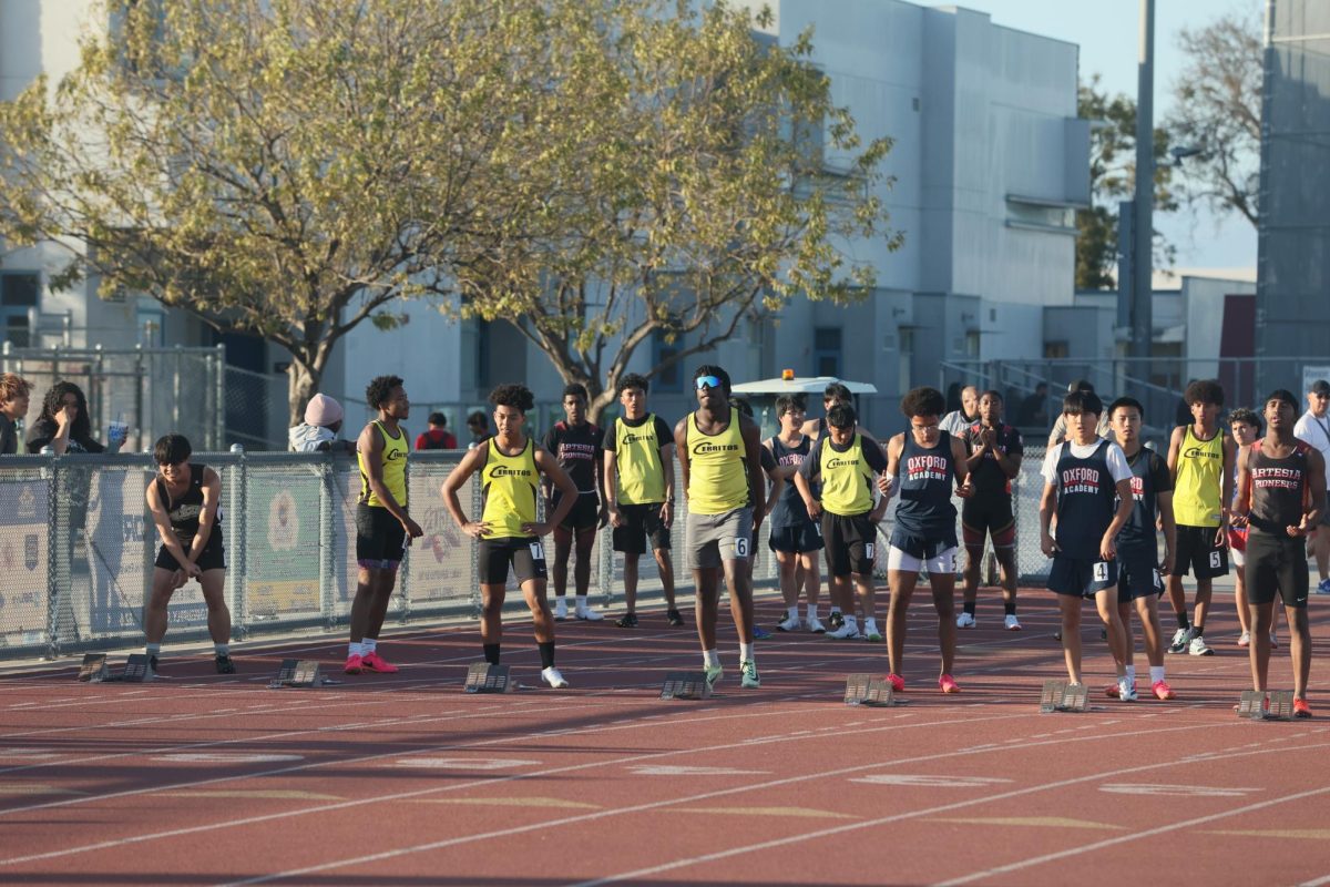 Cerritos High School's boys track team prepares to race against Oxford Academy and Artesia High School. Photo taken by Joe Chaides.