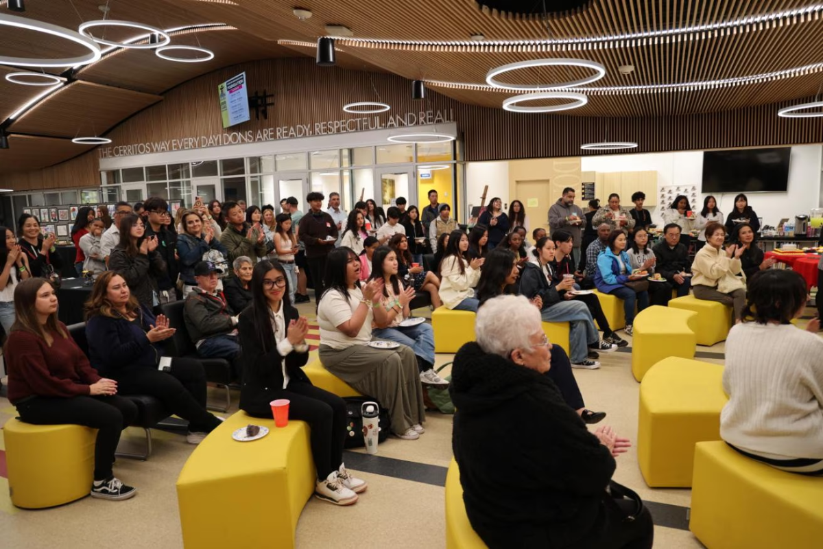 The audience applauses as teacher Mrs. Celia Quiggle announces the winners of the CHS Education Foundation Art Contest Awards. Photo taken by Krish Kohli, used with permission.