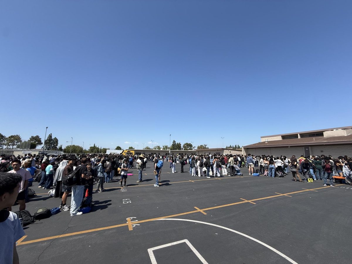 Students, teachers, and staff gather in the blacktop. Photo taken by Salvador Flores.