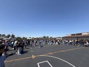 Students, teachers, and staff gather in the blacktop. Photo taken by Salvador Flores.